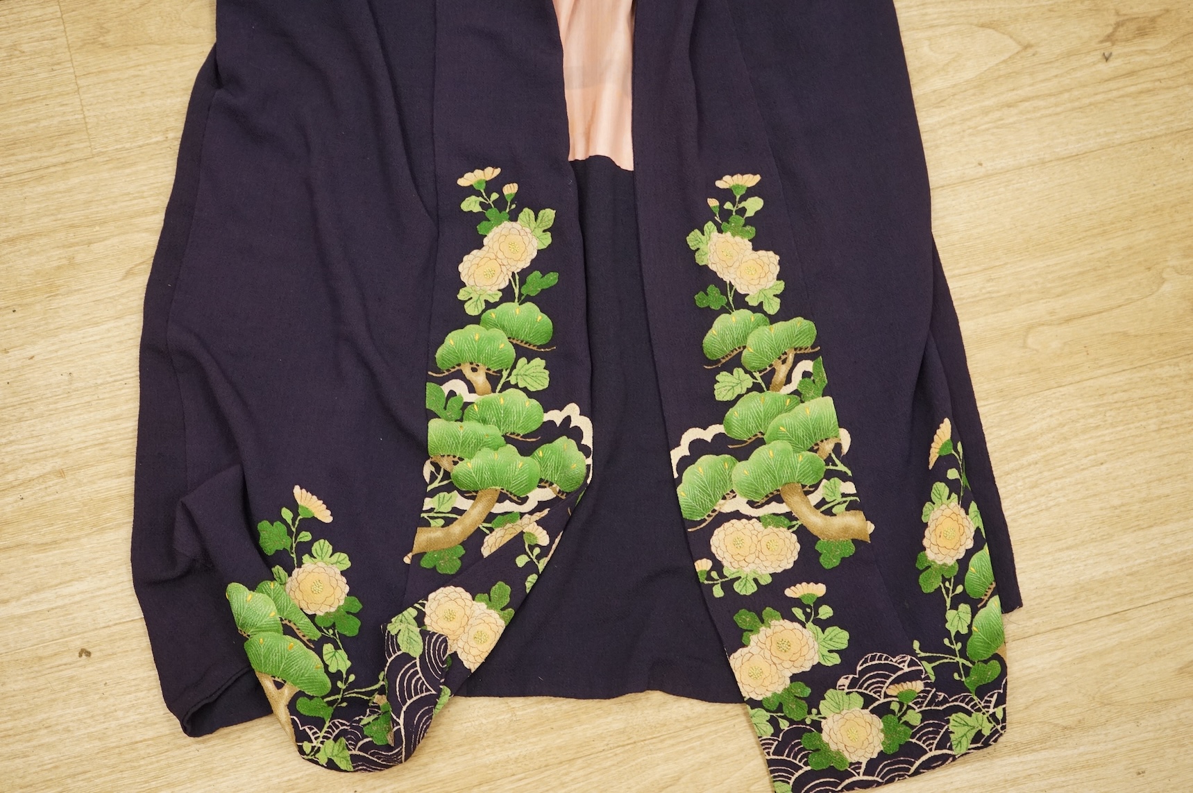 A collection of Chinese and Japanese embroidered kimonos and textiles